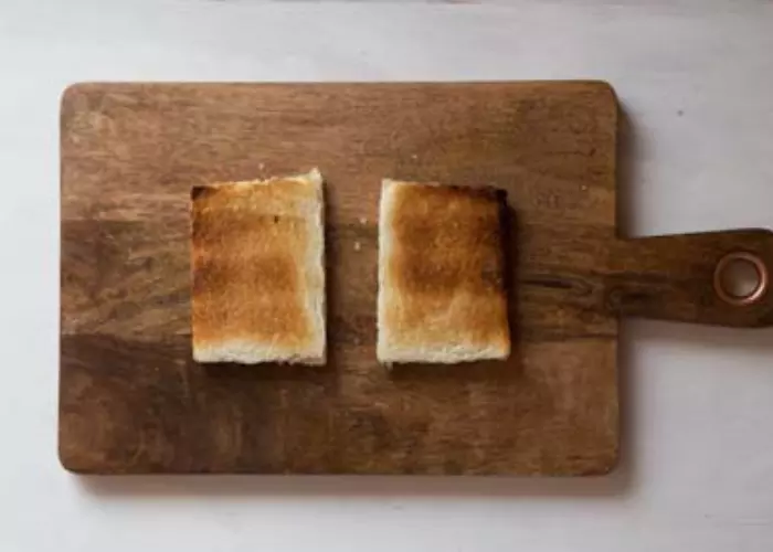 Toast the slices of bread in your toaster and toast until they are golden brown